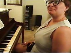 Chubby mature plays piano